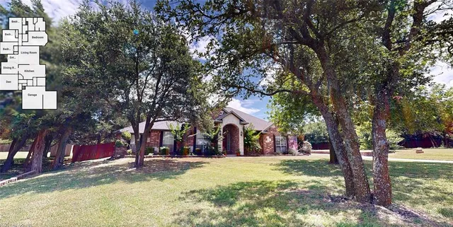 a view of a park with large trees