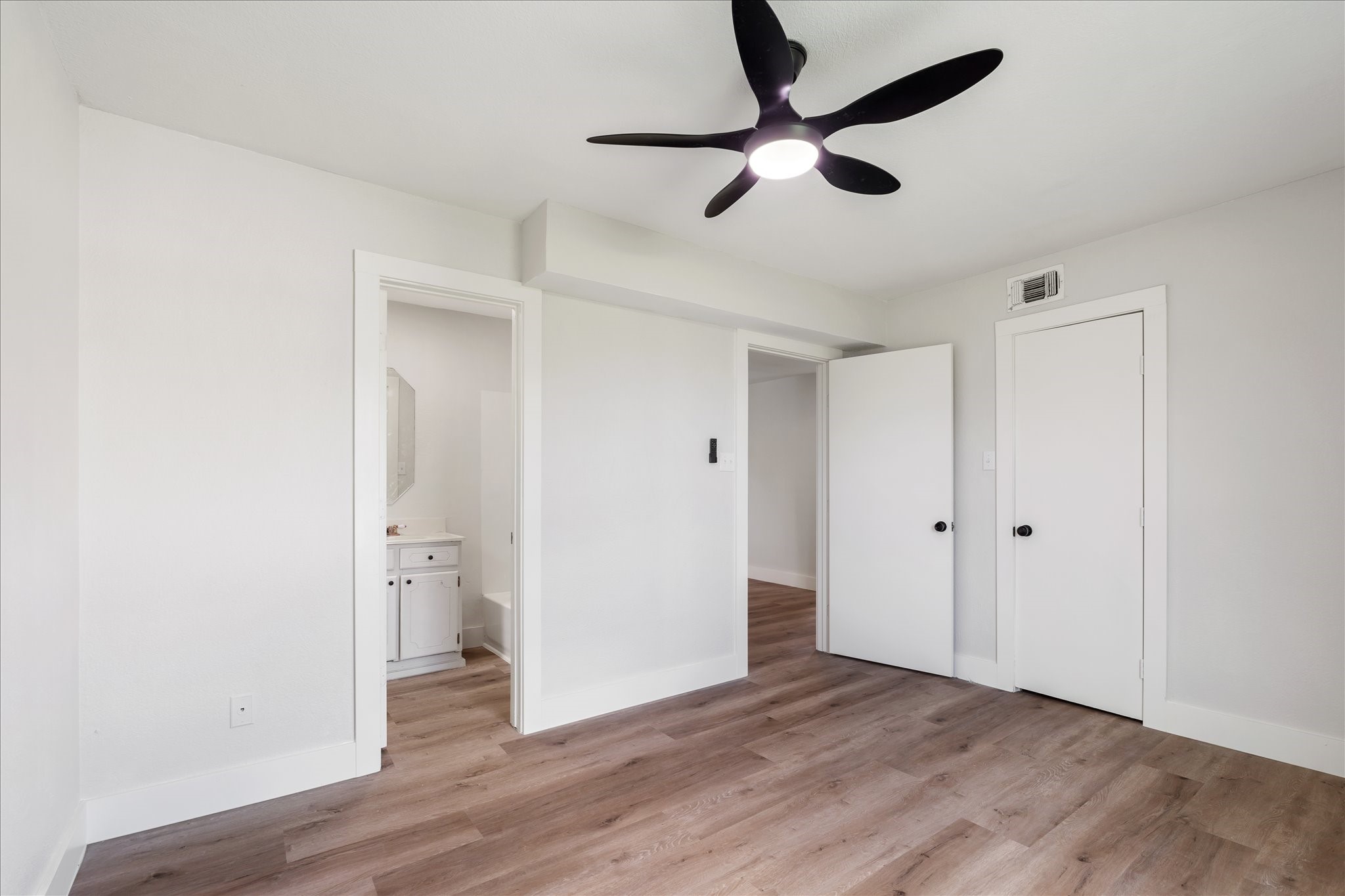 7104 Dallas Street, Unit 1 Baytown, TX 77521 - Photo 12 of 17 wooden floor in an empty room