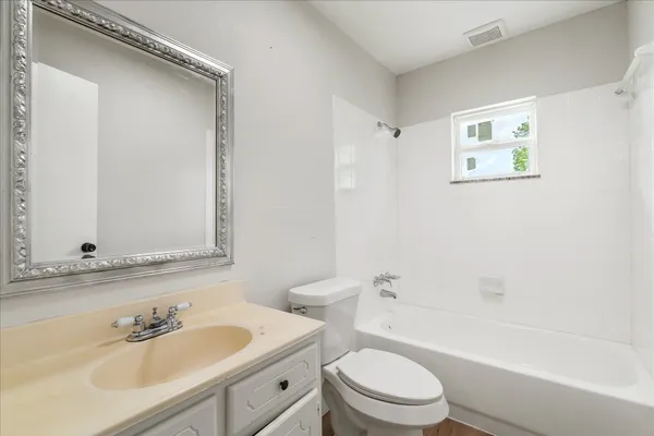 a bathroom with a sink a toilet and a bathtub