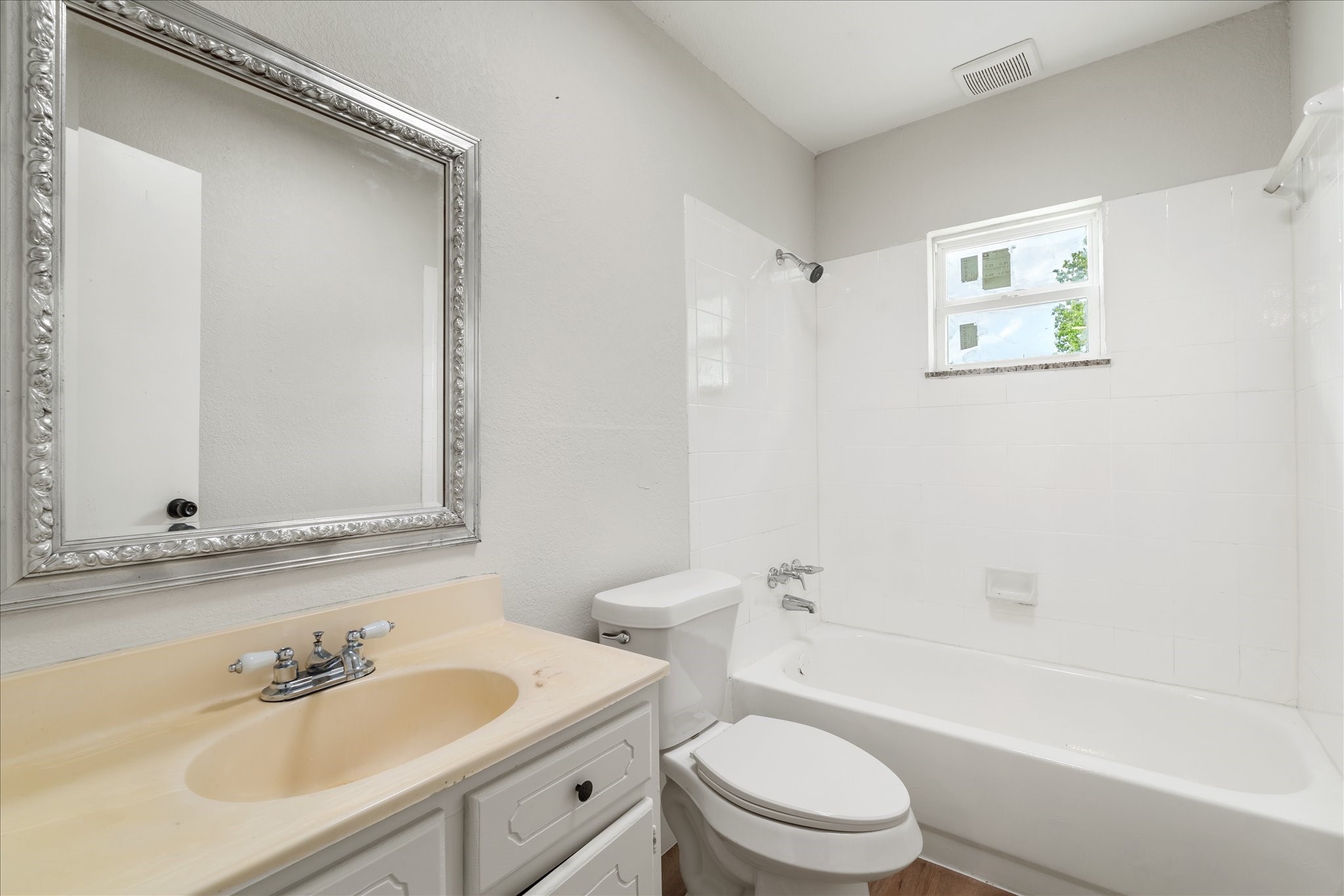 7104 Dallas Street, Unit 1 Baytown, TX 77521 - Photo 15 of 17 a bathroom with a sink a toilet and a bathtub