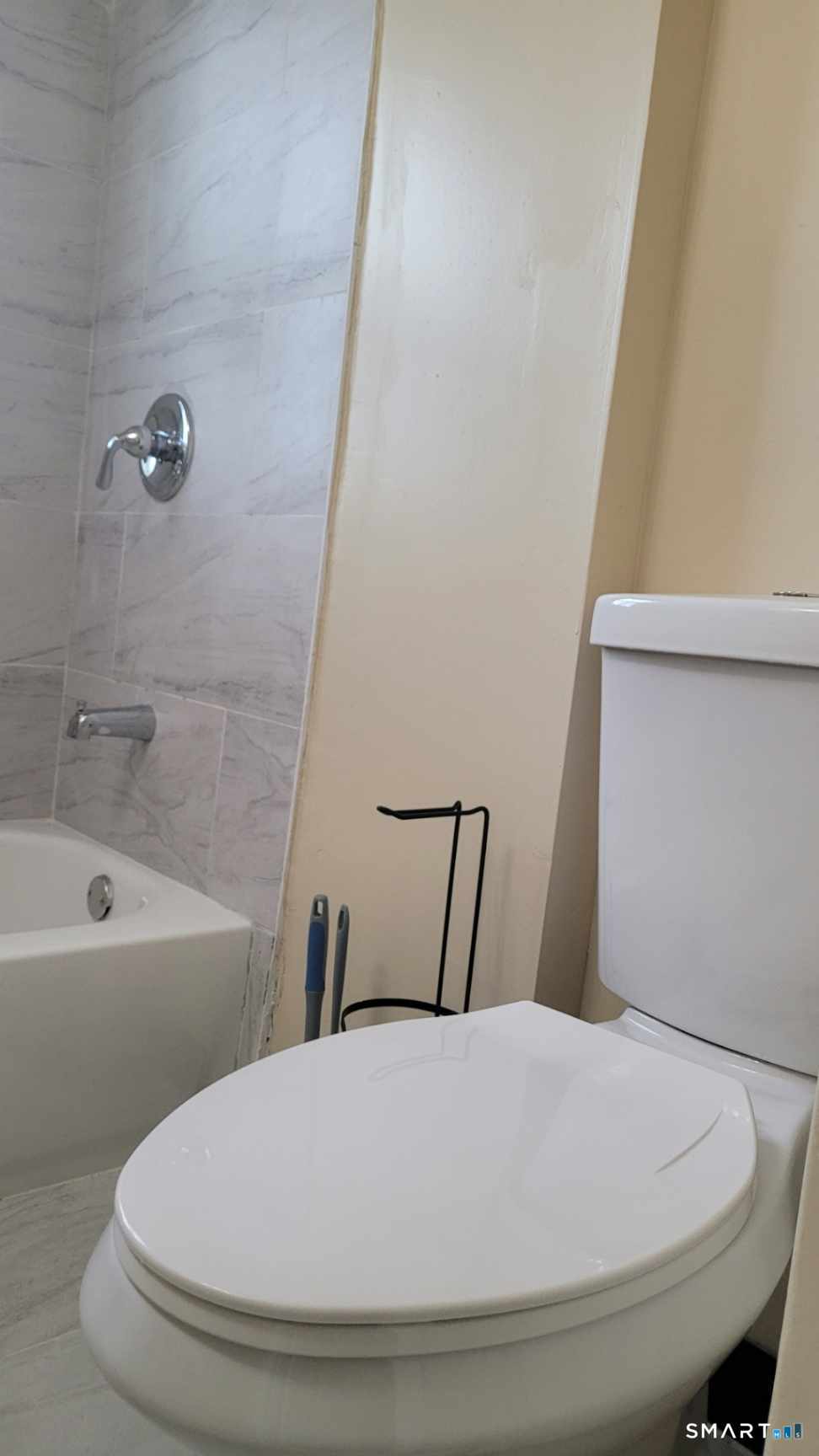 98 East Burnham Street Bloomfield, CT 06002 - Photo 11 of 18 a bathroom with a sink and bathtub