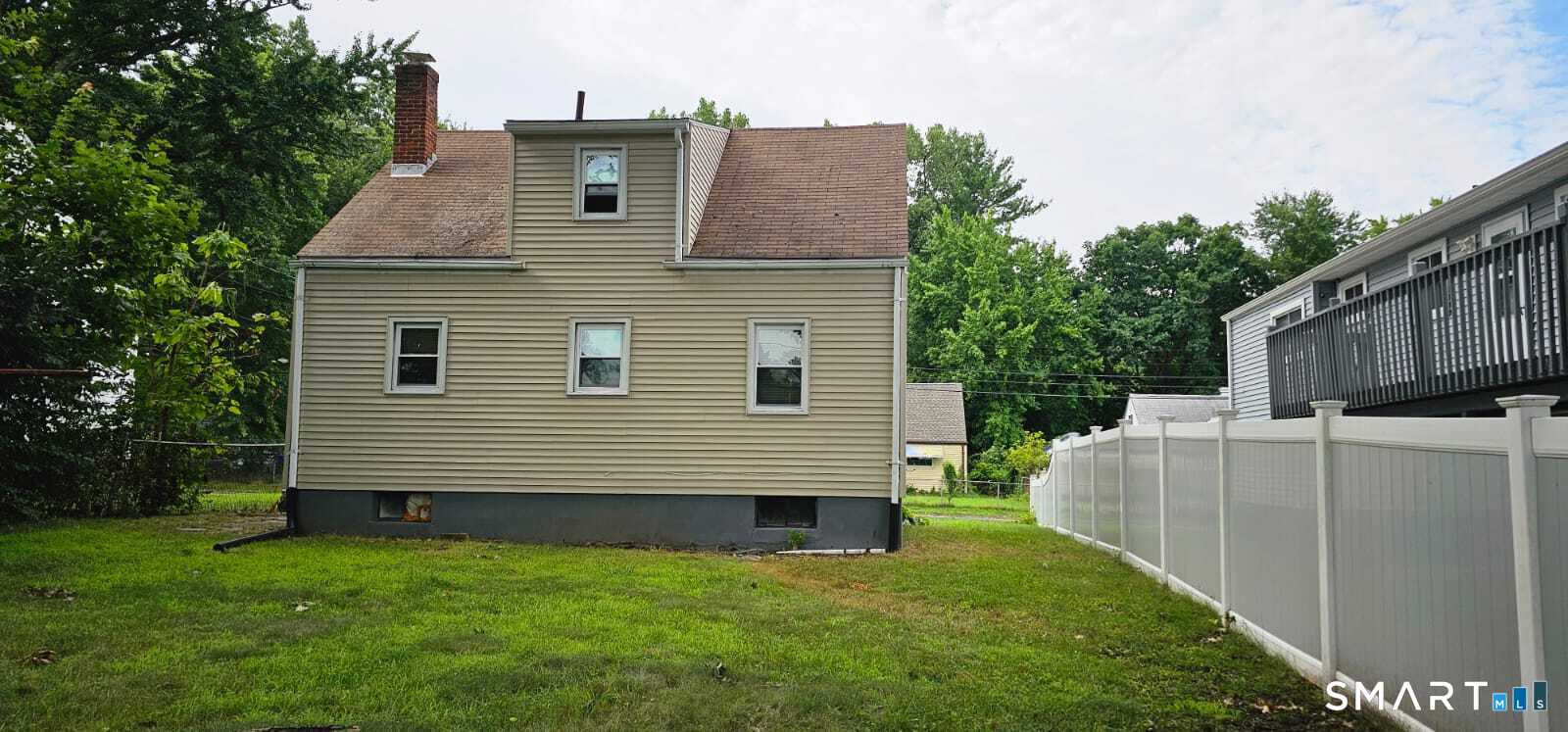 98 East Burnham Street Bloomfield, CT 06002 - Photo 17 of 18 a view of a house with a yard