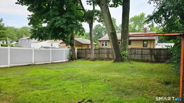 a backyard of a house with lots of green space