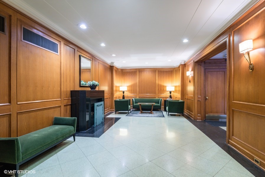421 West Melrose Street, Unit 5B Chicago, IL 60657 - Photo 3 of 15 a room with furniture and a fireplace
