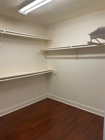 a view of an empty walk in closet