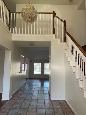 a view of entryway and hall with a window