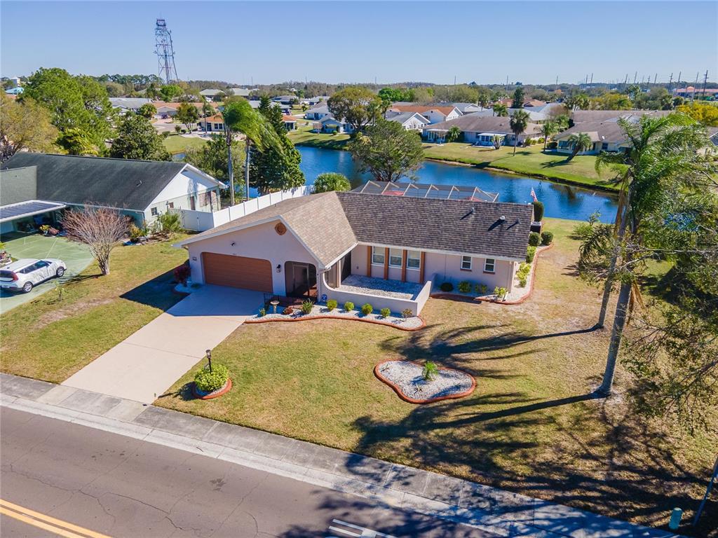 803 El Rancho Drive Sun City Center, FL 33573 - Photo 1 of 1 an aerial view of a house with swimming pool and outdoor seating