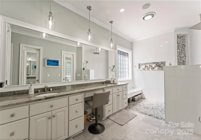 a bedroom with bed and wooden floor