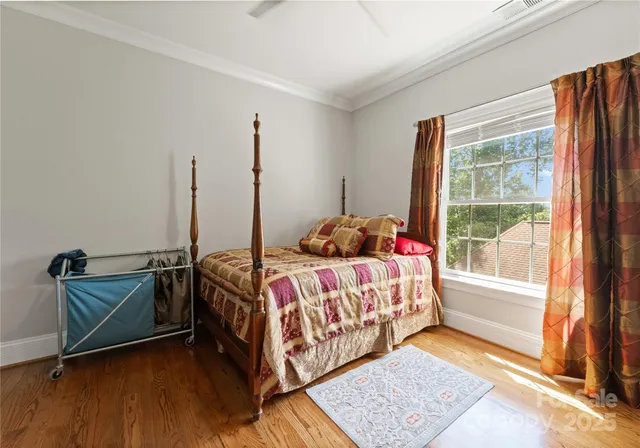 a bathroom with a granite countertop sink a mirror and shower