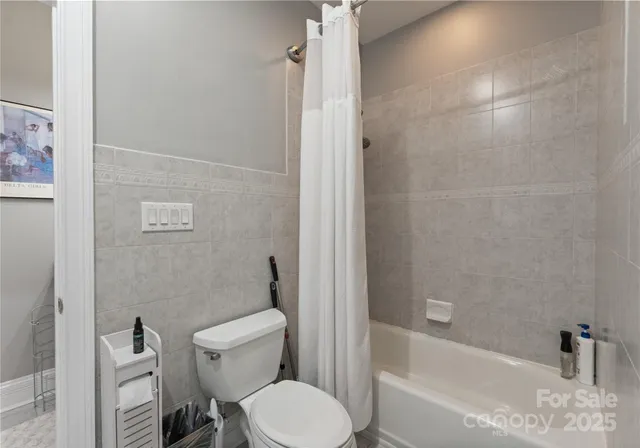 front view of a house with a tree