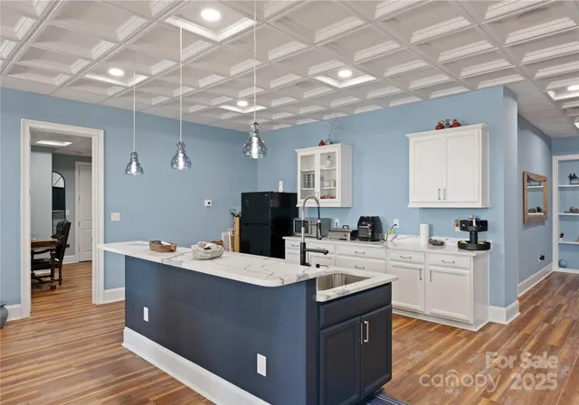 an aerial view of a house with a yard and lake view