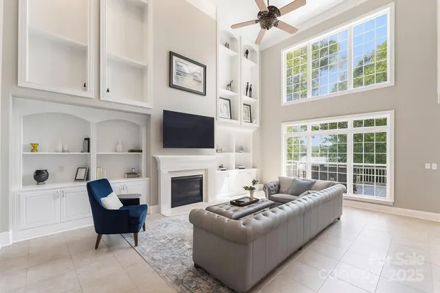 a living room with furniture fireplace and a flat screen tv