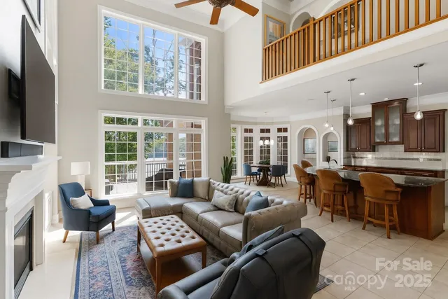 a kitchen with stainless steel appliances granite countertop a kitchen island a stove and a sink