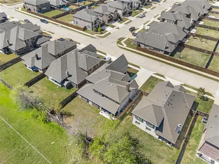 an aerial view of a house with a swimming pool