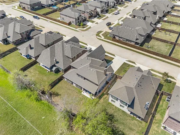 an aerial view of a house with a swimming pool