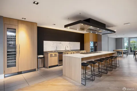 a kitchen with a stove and a refrigerator
