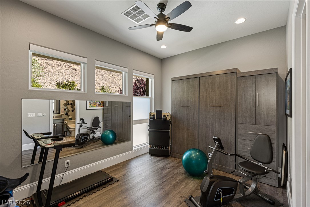 10118 Copper Edge Road Las Vegas, NV 89148 - Photo 22 of 48 An adaptable exercise room features recessed lighting and durable wood flooring.