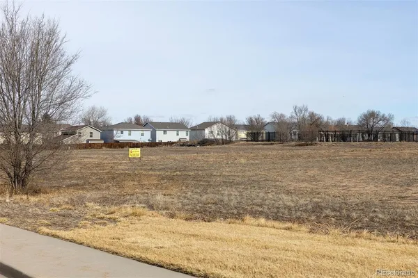 a view of ocean with residential houses