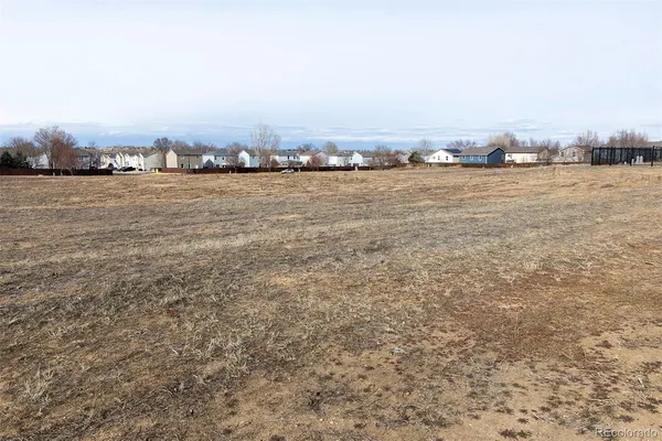 an ocean beach with city view