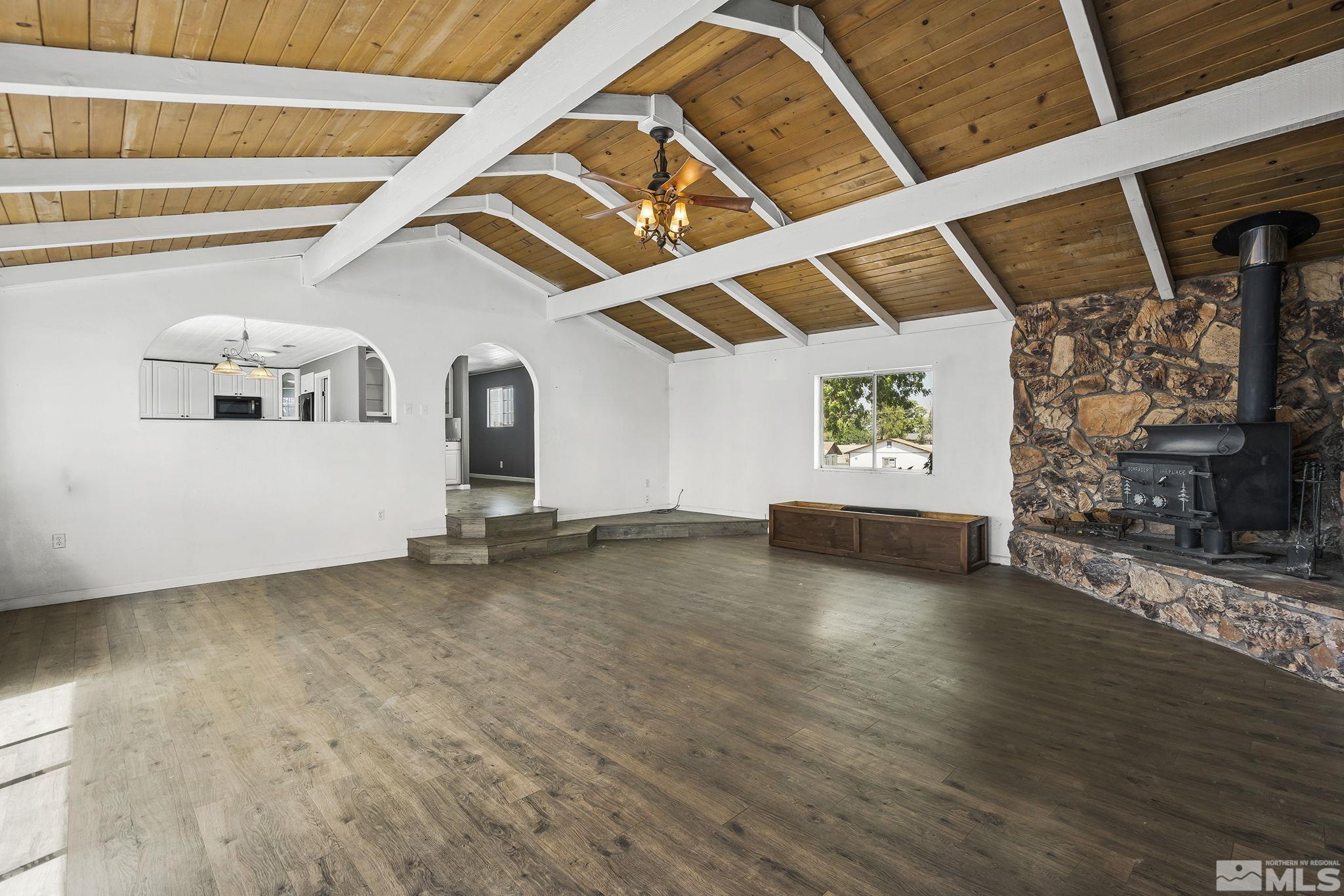 1245 Rice Road Fallon, NV 89406 - Photo 5 of 20 an empty room with wooden floor and windows