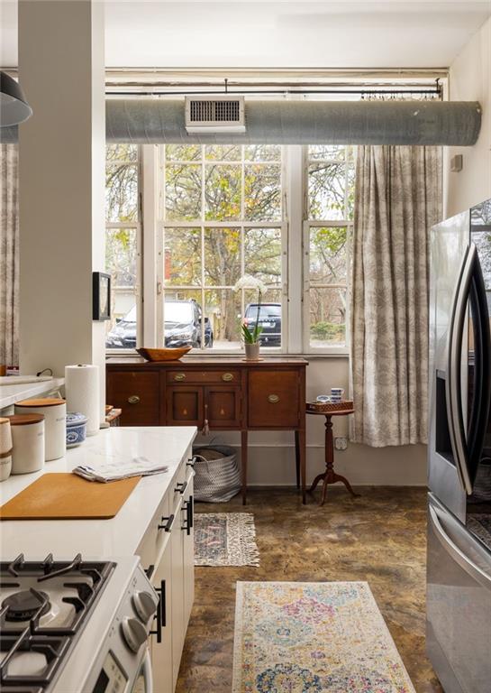 138 Kirkwood Road Northeast, Unit 14 Atlanta, GA 30317 - Photo 12 of 38 a living room with furniture and a window