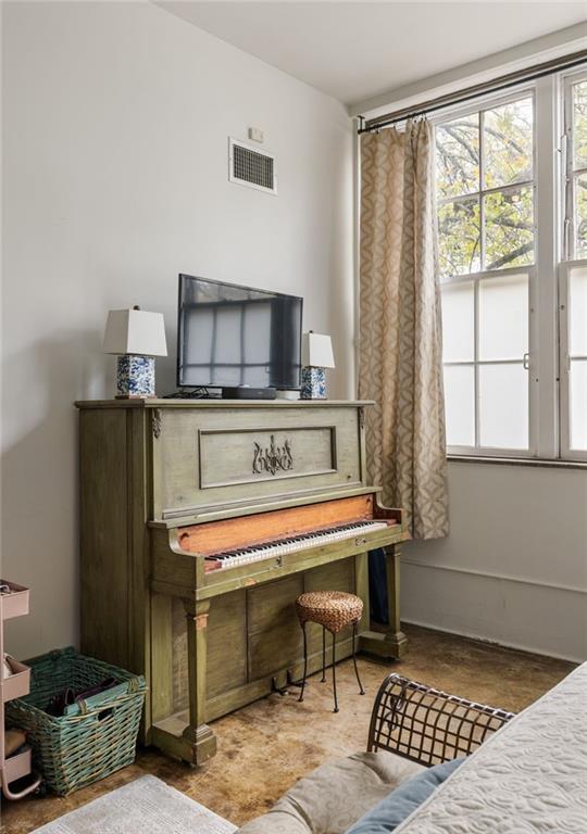 138 Kirkwood Road Northeast, Unit 14 Atlanta, GA 30317 - Photo 18 of 38 a living room with furniture a flat screen tv and a window
