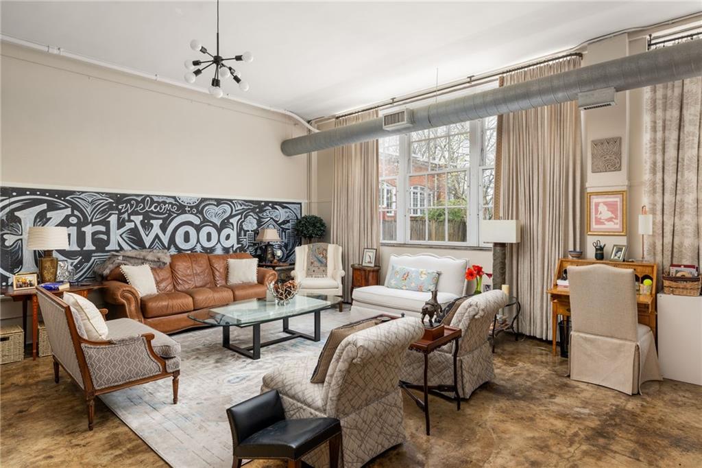 138 Kirkwood Road Northeast, Unit 14 Atlanta, GA 30317 - Photo 2 of 38 a living room with furniture and a window