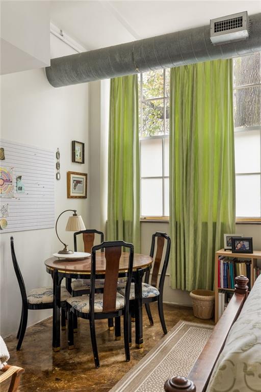 138 Kirkwood Road Northeast, Unit 14 Atlanta, GA 30317 - Photo 23 of 38 a view of a dining room with furniture and a window