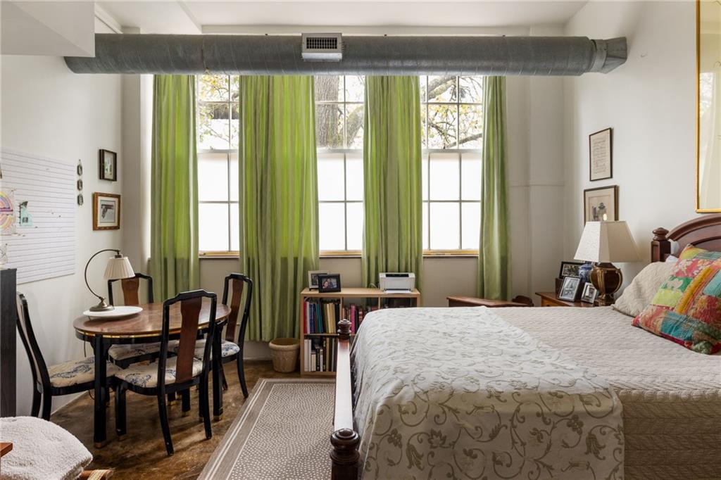 138 Kirkwood Road Northeast, Unit 14 Atlanta, GA 30317 - Photo 25 of 38 a bedroom with a bed and a windows