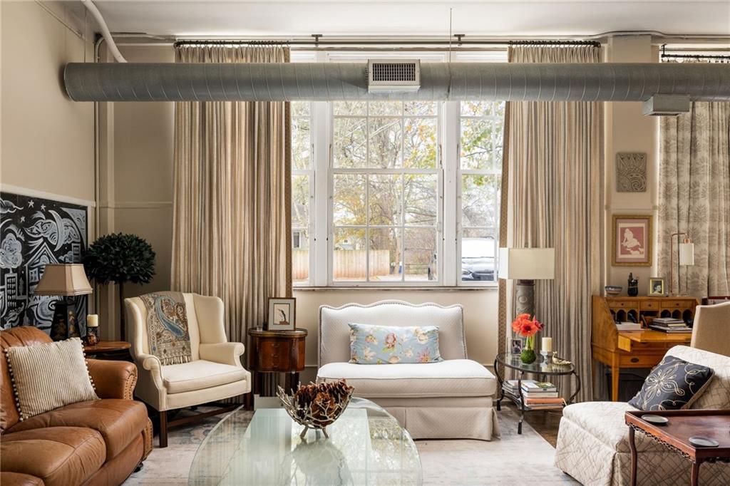 138 Kirkwood Road Northeast, Unit 14 Atlanta, GA 30317 - Photo 3 of 38 a living room with furniture and a large window