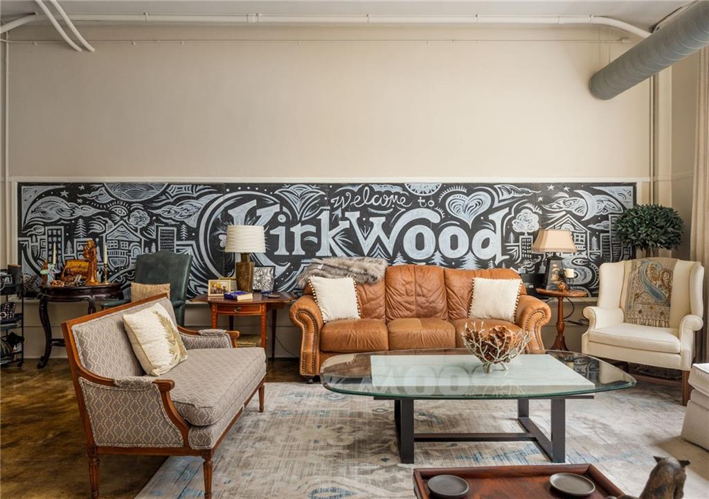 138 Kirkwood Road Northeast, Unit 14 Atlanta, GA 30317 - Photo 4 of 38 a living room with a couch and a table