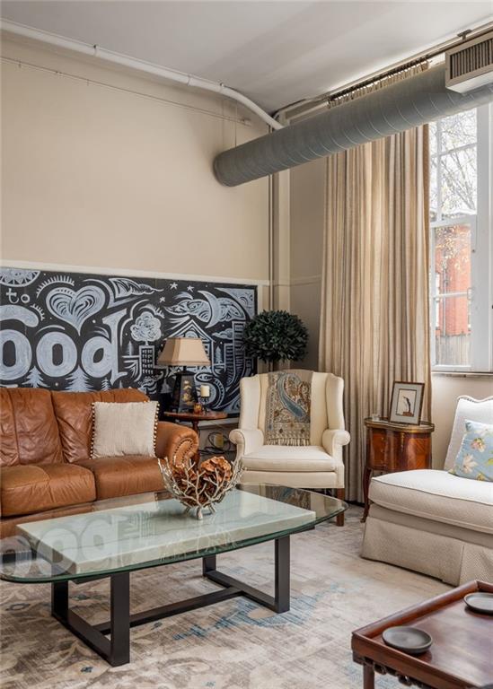 138 Kirkwood Road Northeast, Unit 14 Atlanta, GA 30317 - Photo 5 of 38 a living room with furniture and a window