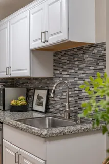 a kitchen with a granite counter tops and a stove