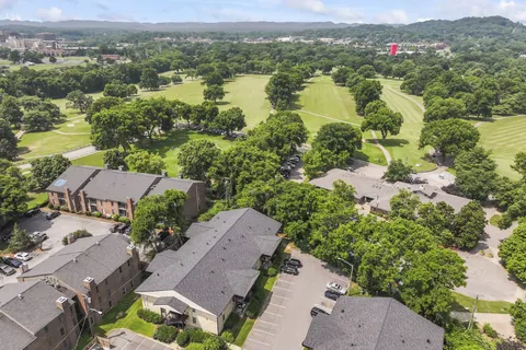 an aerial view of residential house with outdoor space and river