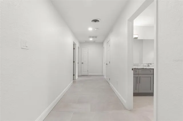 a bathroom with a granite countertop sink mirror and double
