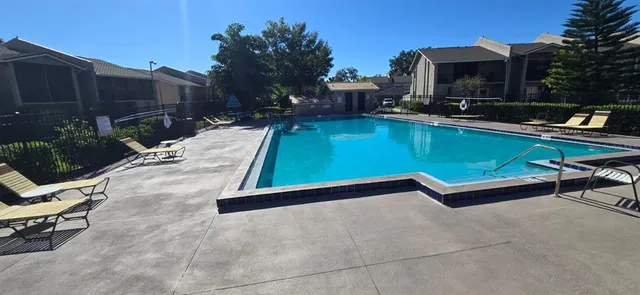 a backyard of a house with yard and outdoor seating