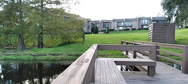 a view of a lake with a house in the background