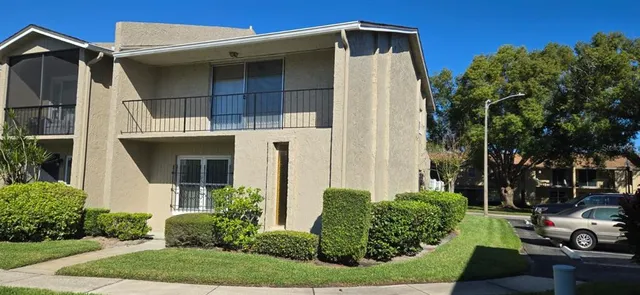 a house with a clock on the side of it