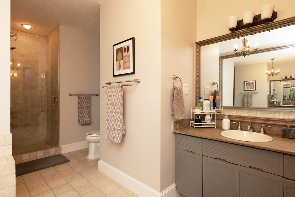 1193 Main Street, Unit A2 Hingham, MA 02043 - Photo 22 of 27 a bathroom with a sink a toilet and shower