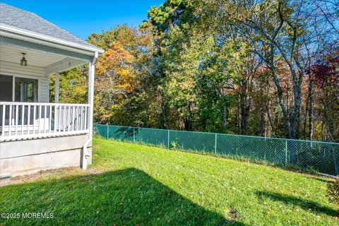 a view of a backyard with a small cabin