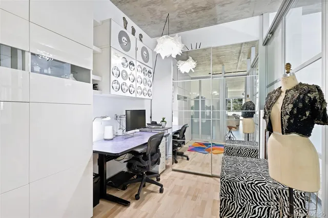 a reading room with furniture and a chandelier
