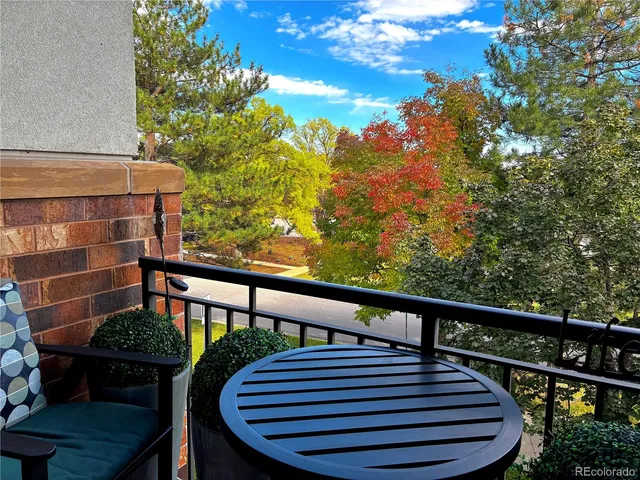 a living room with furniture and a lamp