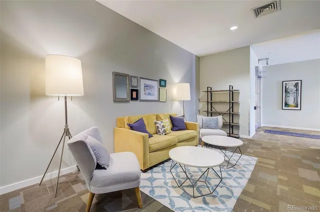 front view of a brick house with a yard