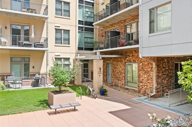 a view of a swimming pool and an outdoor seating