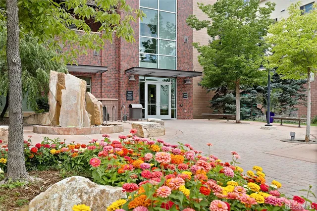 a view of a swimming pool with outdoor seating