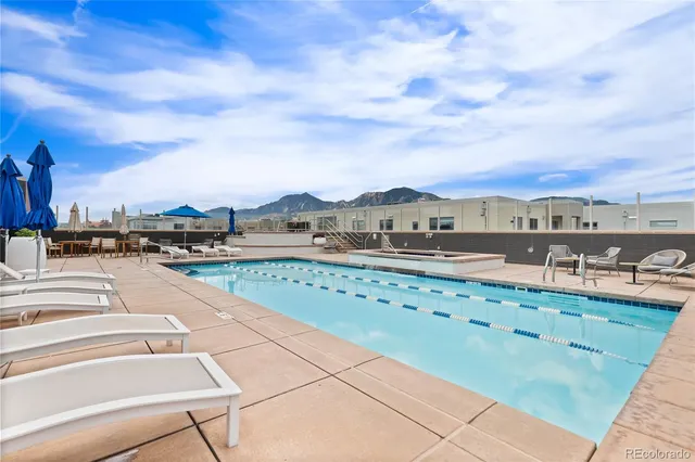 a living room with furniture a table and chairs