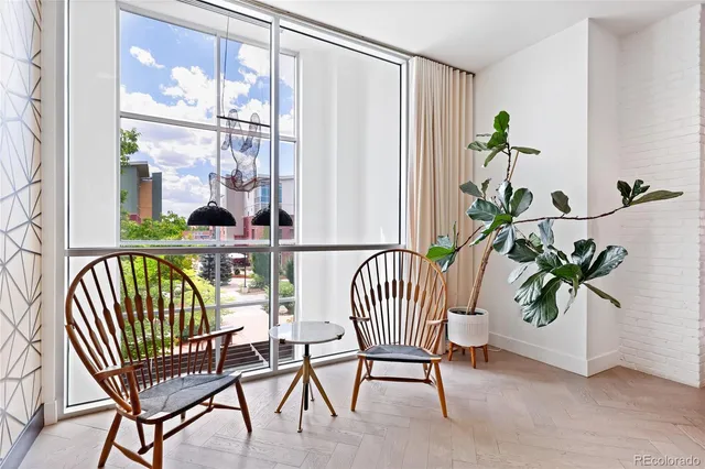 a view of a building with sitting area