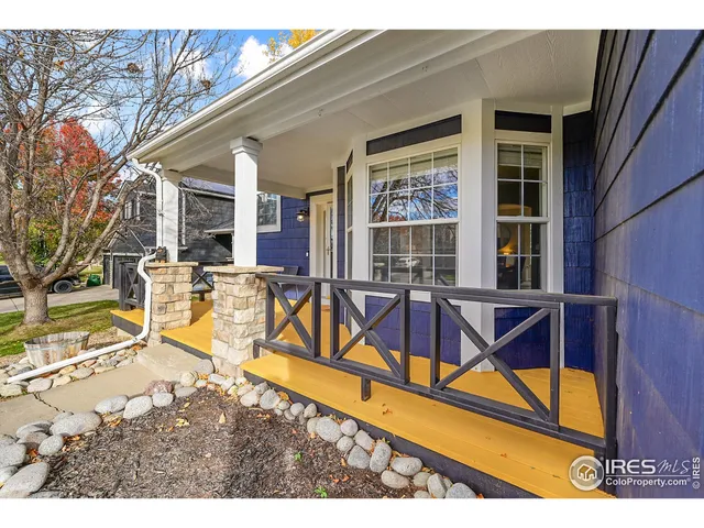 a view of a house with wooden floor and a yard