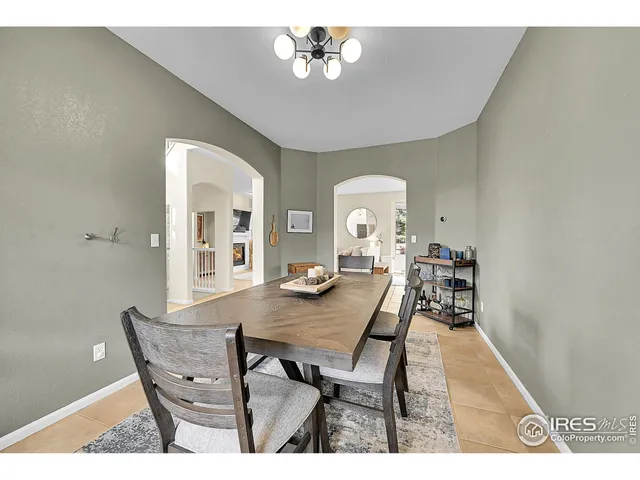 a living room with fireplace furniture and a flat screen tv
