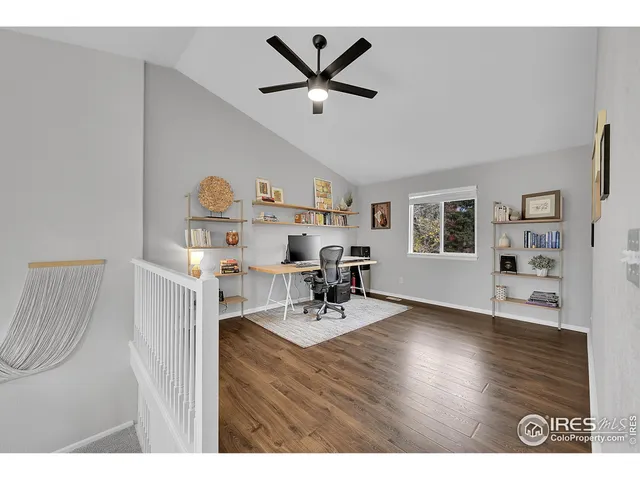 a living room with furniture a dining table and wooden floor